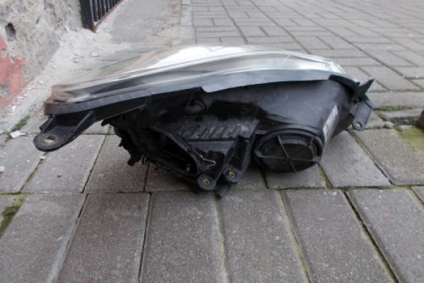 Opel - Corsa - D - 5 drzwi - (2006 - 2011) - Oświetlenie / Lampa przednia lewa