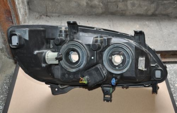 Opel - Zafira A - (2003 - 2005) - Oświetlenie / Lampa przednia lewa