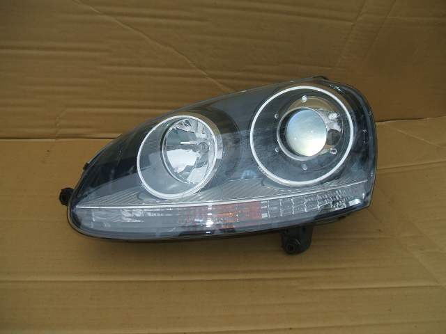 Volkswagen - Golf V - Kombi - (2007 - 2009) - Oświetlenie / Lampa przednia  lewa Bixenon