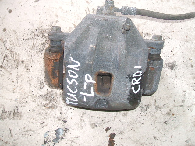 Hyundai - Tucson - (2010 - 2015) - Hamulce / Zacisk hamulcowy przedni lewy