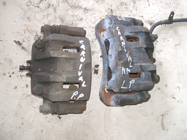 Kia - Carnival II - (2010 - 2015) - Hamulce / Zacisk hamulcowy przedni lewy